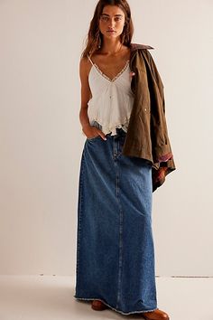 Forever cool and classic denim maxi from our We The Free collection. **Fit:** Mid-rise, A-line silhouette and rigid denim **Features:** Zip fly and button closure, four-pocket design, inverted yoke seam at front, raw-edge hem **Why We | We The Free Come As You Are Denim Maxi Skirt at Free People in Dark Wash, Size: US 2 Long Denim Skirt Outfit, Jean Skirt Outfits, Long Jean Skirt, Denim Skirt Outfits, Long Denim Skirt, Maxi Skirt Outfits, Denim Maxi, Free People Skirt, Denim Maxi Skirt