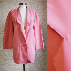 "80's retro blazer in solid pink with button closure. Blazer was tailor made from typical 80's poly blend. Will fit size M-L, but can be also wear as oversized for size S.  Measurements: bust 42\" // 107cm sleeve length 22\" // 56cm length 32\" // 81cm shoulder to shoulder 16\" // 41cm Label: tailor made  Material: poly Condition: good vintage, several small stains Check more from our offer at www.etsy.com/shop/VintageCriminal  We ship from the heart of Europe and our vintage finds are from around here. We care for the condition of items we sell and always provide honest description. Any questions? Contact us, we will gladly answer them! And don't forget to follow us on Instagram and Facebook @vintage.criminal" Retro Spring Blazer With Lapel Collar, Retro Lapel Collar Blazer For Spring, Retro Blazer With Lapel Collar For Spring, Retro Notch Lapel Blazer For Spring, Pink Single Button Blazer For Fall, Vintage Tailored Blazer For Spring, Pink Tailored Blazer For Fall, Pink Notch Lapel Blazer For Spring, Tailored Pink Blazer For Fall