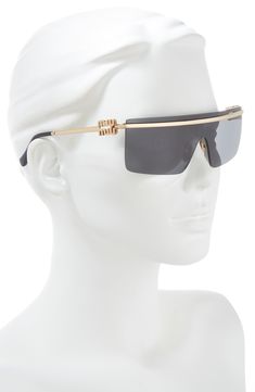 Polished metal frames add a glamorous vibe to Italian-made sunglasses detailed with bold signature logo hardware at the temples. 50mm lens width; 130mm temple length 100% UV protection Adjustable nonslip nose pads Metal Made in Italy Designer Gold Shield Sunglasses With Gradient Lenses, Modern Gold Shield Sunglasses With Metal Frame, Modern Gold Shield Sunglasses With Tinted Lenses, Modern Gold Tinted Shield Sunglasses, Luxury Gold Shield Sunglasses With Uv Protection, Luxury Gold Shield Sunglasses With Uva Protection, Modern Miu Miu Sunglasses For Formal Occasions, Modern Gold Shield Sunglasses With Square Frame, Miu Miu Gold Sunglasses With Tinted Lenses