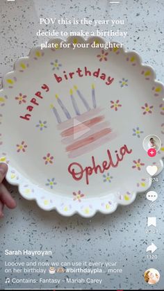 someone is holding a plate with a birthday cake on it that says happy birthday ophela