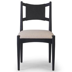 a black chair with a beige seat and back