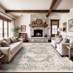 a living room filled with furniture and a fire place in the middle of a room