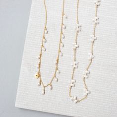 This delicate freshwater bead pearl necklace stands on it's own as a classic wardrobe staple and can be layered with any necklace.Handmade by our expert team of female artisans and crafted with a delicate 14k gold-plated chain.Adjustable length "16-18". Adjustable Pearl Necklace With Delicate Chain, Adjustable Gold Plated Pearl Necklace With Pearl Drop, Adjustable Delicate Chain Pearl Necklace For Everyday, Adjustable White Pearl Necklace With 14k Gold Filled, Delicate Everyday Beaded Necklace With Pearl Pendant, Everyday Delicate Beaded Necklace With Pearl Pendant, Delicate Everyday Beaded Necklace With Pearl Chain, Adjustable White Pearl Necklace In 14k Gold Filled, White Delicate Pearl Necklace For Layering