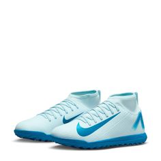 a pair of white and blue nike soccer shoes