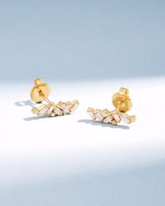 Crafted with 18-karat gold, these elegant baguette diamond studs bring a touch of sophistication to any ensemble. Perfect as a stylish update to your jewelry collection or as a meaningful gift. Details 18k yellow gold, rose gold or white gold 0.60 carats of baguette and round white diamonds 15x5mm dimensions Ref: BAE555 Elegant Gold Diamond Earrings With Baguette Diamonds, Elegant Gold Diamond Earrings With Baguettes, Luxury Diamond Earrings With Baguette Diamonds, Elegant Yellow Gold Diamond Earrings With Baguette Diamonds, Timeless Gold Diamond Earrings With Baguette Diamonds, Gold Baguette Diamond Earrings For Anniversary, Timeless Gold Baguette-cut Diamond Earrings, Timeless Gold Baguette Cut Diamond Earrings, Anniversary Gold Baguette Diamond Earrings