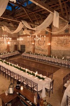 an indoor wedding venue with tables and chairs