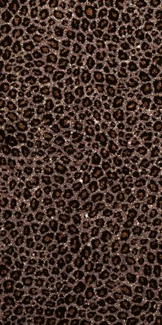 an animal print pattern is shown in brown and black