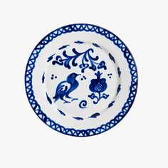 a blue and white plate with birds on it