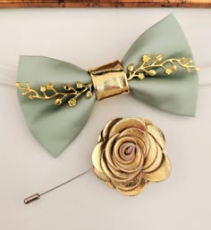 a close up of a bow tie with a flower on it