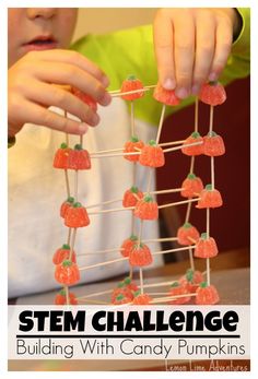 a child is playing with strawberries and stringing the strings to make it look like they are holding something