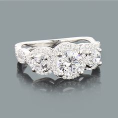 three stone ring with diamond shoulders