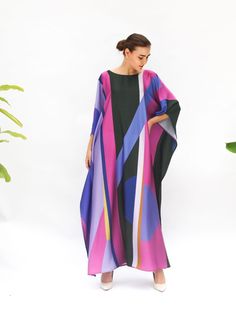 "Upgrade your wardrobe with our abstract art print kaftan! Stand out from the crowd with its bold and vibrant designs, crafted from high-quality and durable materials and possible with the free of charge for length and size custom made. Shop now and elevate your fashion game with this versatile wardrobe essential.  *please be noted, this kaftan is blended silk- if you prefer the 100% silk please type \"pure\" or \"natural\" in my shop as I do have different fabric composition. FEATURES - Purple, Multicolor Abstract Print Kaftan For Spring, Spring Multicolor Kaftan With Abstract Print, Multicolor Abstract Print Kimono For Beach, Multicolor Kaftan With Vibrant Print And Kimono Sleeves, Vibrant Multicolor Printed Kaftan, Spring Multicolor Abstract Print Kaftan, Summer Multicolor Abstract Print Kaftan, Oversized Multicolor Printed Maxi Dress, Printed Multicolor Tunic Kimono