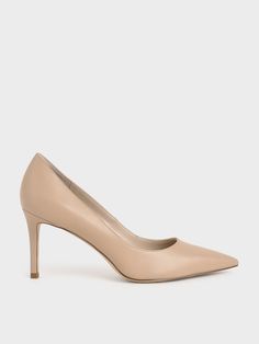 Designed in a timeless silhouette and finished in a versatile shade, these go-with-anything nude pumps are destined to become a wardrobe staple. Bonus points for the pointed toe that elongates your frame, as well as stiletto heels that elevate your look effortlessly. Pair them with an A-line skirt and a black mock neck top for a simple yet stunning finish. Black Mock Neck Top, Nude Stiletto Heels, Neutral Pumps, Nude Colour, Tan Pumps, Neutral Heels, Nude High Heels, Black Mock Neck, Pumps Heels Stilettos