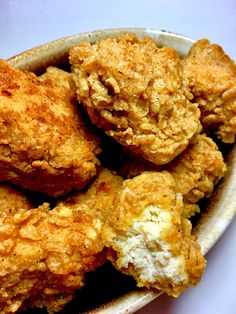 some fried food in a white bowl on a table