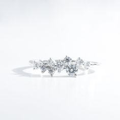 three diamond cluster ring on white background