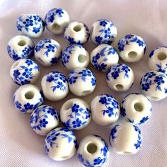 blue and white porcelain beads with flowers on them