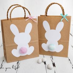 two brown paper bags with bunny ears on them