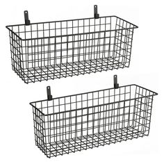 two black wire baskets sitting next to each other