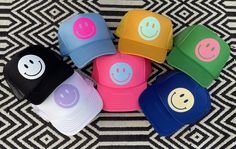 HappyStack Shop is excited to introduce our new Happy Hues™️Collection! Our Smiley Face Trucker Hat is sure to bring a smile to everyone you pass by. Adjustable--one size fits most, comfortable, and breathable. See our new Kids Listings for available colors in our kids size trucker--now available in the OG Smiley Patch and our Happy Hues™️ Collection. Keep smiling friends! Fun Flat Brim Hat As Gift, Fun Flat Brim Hat As A Gift, Cute Multicolor Curved Brim Hat, Fun Flat Brim Hat For Gift, Fun Blue Hats For Gifts, Multicolor Casual Baseball Cap Gift, Fun Bucket Hat As A Gift, Casual Multicolor Baseball Cap Gift, Casual Multicolor Baseball Cap As Gift