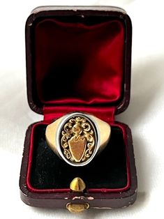 Beautiful Antique Italian 18k Yellow Gold & Platinum Family Crest Signet Ring. This ring is so beautiful and unusual, with a halo of platinum around the yellow gold setting to give more contrast to the finely engraved engraved crest. It was made at the beginning of Twentieth century. It is hallmarked 750 for gold purity (18k gold). The top part measured 16 by 11 mm.  US size: 7 3/4 (it can be resized upon request) Weight: 12.10 grams Good antique conditions. Thank you for visiting Boudoir Vintage!   Please feel free to contact me for further information or photos.  I offer international shipping. Your item will be packed with extreme care and will be shipped within 3-5 working days. If you are dissatisfied with your item, please feel free to contact me and would be happy to assist.  If you Luxury Gold Engraved Ring With Hallmarks, Ceremonial Oval Signet Ring Stamped 14k, Formal Oval Engraved Ring With Intaglio, Oval Engraved Ring With Intaglio For Formal Events, Luxury Oval Signet Ring With Intaglio, Elegant Ceremonial Signet Ring With Engraving Option, Timeless Formal Engraved Ring With Hallmarks, Formal Oval Signet Ring With Intaglio, Classic White Gold Signet Ring For Ceremonial Occasions