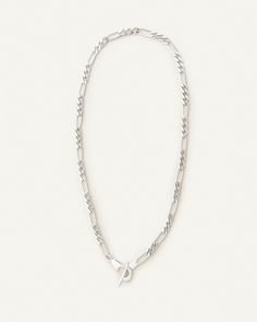 Sterling silver classic fígaro style chain with unique toggle closure. Classic Sterling Silver Figaro Chain Necklace, Sterling Silver Figaro Chain Necklace With Rectangular Links, Modern Silver Jewelry With Figaro Chain, Classic Silver Figaro Chain Necklace, Sterling Silver Figaro Chain Necklace With Oval Links, Classic Sterling Silver Toggle Necklace, Classic Chain Link Toggle Necklace With Lobster Clasp, Silver Link Toggle Necklace With Lobster Clasp, Silver Jewelry With Figaro Chain And Rectangular Links