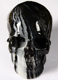 a black and white skull with sunglasses on it's face