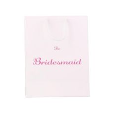 a white bag with the words bridesmaid printed on it and pink lettering that reads,'the bridesmaid '