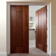 two wooden doors open in an empty room