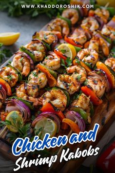 chicken and shrimp kebobs on a cutting board