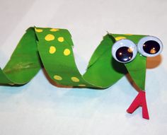 a close up of a paper snake on a table