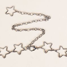 Shining Star Chain Belt - Boogzel Apparel Silver Star Chain Necklace, Silver Star Necklace With Chain, Star Charm Necklace For Festivals, Silver Star-shaped Clavicle Chain Necklace, Trendy Metal Star Chain Necklace, Trendy Silver Star-shaped Chain Necklace, Trendy Silver Star Chain Necklace, Trendy Metal Chain Necklace With Star Shape, Trendy Star-shaped Chain Necklace With Adjustable Chain