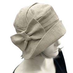 This is the Alice shown here in a pale gray Linen , in true Downton Abbey Style . The ever gorgeous Alice is stylish, elegant and Oh so Comfortable! Alice is styled on the designs from the flapper period. A time in the 1920's and 30's when hats were a MUST.Look the part, whether it be a vintage inspired occasion or one where you want to look and feel polished, finished and have that "wow" factor. Wear your Alice with pride and distinction on your next cruise or even your walk along the beach Mad Flapper Fashion, Downton Abbey Style, 1930s Hats, Bespoke Hats, Dressy Hats, Downton Abbey Fashion, Hat With Bow, 1920s Style, Millinery Hats