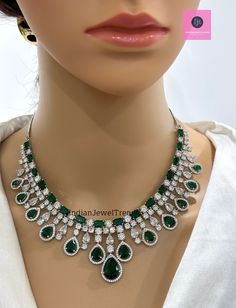 Emerald CZ diamond bridal necklace, American Diamond wedding necklace, Cz jewelry, Indian, Pakistani, and Punjabi wedding jewelry  Regular Size And Adjustable with rhodium finish Ships from California, USA Delivery in 2-5 business days in the USA. Other colors can be found here https://www.etsy.com/listing/1423096838/ruby-cz-diamond-bridal-necklace-american?ref=listings_manager_grid https://www.etsy.com/listing/1423097794/sapphire-cz-diamond-bridal-necklace?ref=listings_manager_grid Color, shades, and texture displayed may slightly vary from the actual product due to digital image limitations. We request you consider these minor variations. Please expect the possibility of some slight imperfections when buying handmade jewelry. Please let me know if you have any questions. Arrives in a gif Wedding Necklace With American Diamond In Elegant Design, Elegant American Diamond Necklace For Wedding, Fine Jewelry Emerald Necklace With 17 Jewels For Wedding, Green Diamond Necklace For Wedding, Dazzling Hand Set Emerald Necklace For Wedding, Dazzling Hand-set Emerald Necklace For Wedding, Wedding Emerald Necklace With Diamond Accents, Green Wedding Necklaces With Sparkling Stones, White Gold Hand Set Emerald Necklace For Wedding