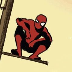 a spider man sitting on top of a pole next to a telephone pole and looking at the sky