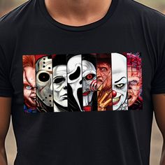 a man wearing a black t - shirt with four different faces on it