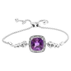 Indulge in the luxury of this exquisite lariat bracelet that captures the essence of elegance and sophistication. The centerpiece of this stunning bracelet is a gorgeous 10mm cushion-cut amethyst gemstone that adds a pop of regal purple color to your outfit. Sparkling round-cut diamonds, totaling 0.05 cttw, delicately encircle the amethyst gemstone, adding a touch of glitz and glamour. The adjustable bolo chain features a unique lariat design that allows you to adjust the length of the bracelet, Glitz And Glamour, Bolo Bracelet, Bracelet Collection, Amethyst Gemstone, Adjustable Bracelet, Cushion Cut, Purple Amethyst, Sterling Silver Bracelets, Link Bracelets