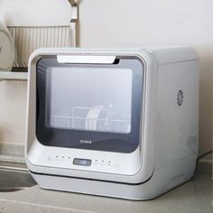 an old computer monitor sitting on top of a counter