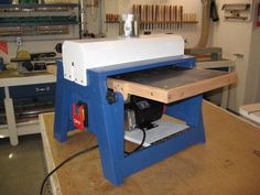 a work bench in a shop with tools on it