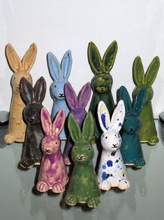 small ceramic rabbits sitting on top of a table