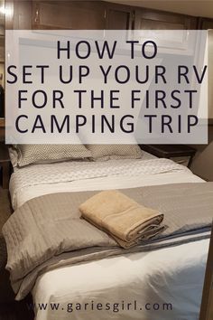 a bed with towels on it and the words how to set up your rv for the first camping trip