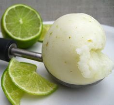 a lime ice cream is on a white plate