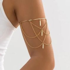 A beautifully bohemian upper arm cuff with gorgeous gold draping chains. The cuff opens and closes for adjustment in size. See our range of body jewellery here https://www.etsy.com/uk/shop/IndisaJewellery?ref=shop_sugg_market&section_id=15529913 See our store here  https://www.etsy.com/uk/shop/IndisaJewellery Indisa jewellery will be lovingly hand wrapped and packaged within our letterbox and eco-friendly signature boxes for that extra special unboxing experience. Sending a gift? Personalise you Body Jewelry Gold, Upper Arm Cuff, Upper Arm Cuffs, Beach Jewellery, Arm Bracelet, Gold Body Jewellery, Unboxing Experience, Arm Bracelets, Gold Bodies