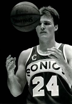 a man holding a basketball in his right hand