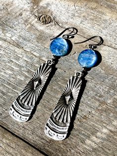 These Oxidized Silver Paddle earrings have a unique Southwestern design and true Western feel. Offering two different gemstone options: * Coin Red Coral * Coin Kyanite (beautiful hues of blue, bronze, and green) Total length = 2.5 inches Sterling Silver ear wire! Artisan Etched Drop Earrings, Adjustable Southwestern Round Earrings, Bohemian Etched Teardrop Jewelry, Southwestern Style Metal Drop Earrings, Southwestern Adjustable Teardrop Earrings, Adjustable Southwestern Teardrop Earrings, Southwestern Metal Earrings For Gift, Southwestern Style Metal Earrings For Gift, Adjustable Southwestern Style Teardrop Earrings