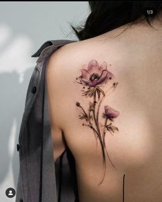 a woman's back with flowers painted on it