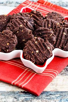 chocolate cookies in a white dish on a red towel