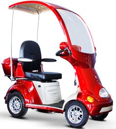 a red and white scooter with a canopy over the back seat on a white background