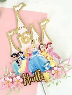 a birthday card with princesses on it and the word hello written in gold foil