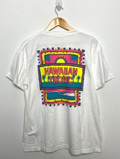 This tee shirt has faint marks on the front side and both sleeves. (Please see photos for flaws) Measurements pit to pit: 22 inches  Top to bottom: 28 inches 90s Style White Shirt With Screen Print, White Hawaiian Top With Sublimation Print, 90s Style T-shirt With Front Print, 90s Style White T-shirt With Front Print, 90s Style Pre-shrunk White T-shirt, White Graphic Print Hawaiian Shirt, Multicolor Short Sleeve Hawaiian T-shirt, Hawaiian Short Sleeve Graphic Print T-shirt, Hawaiian Style Short Sleeve Graphic T-shirt