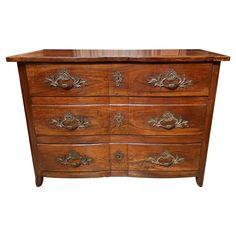 an old wooden dresser with ornate carvings on the top and bottom drawer, isolated against a white background